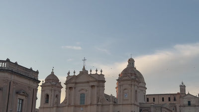 Video of various ruins and architectural marels in Sicily intersperses with artisans working in jewelry and ceramics